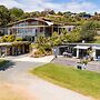 Cable Bay Stays – Golden Sand and Driftwood Beachfront Accommodation