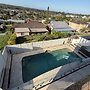 Family Coastal Retreat With Pool and Balcony Views