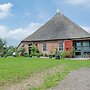 Farmhouse by Lauwers River With Rowing Boat