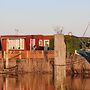 Chalet Gaby With Sauna, Private Dock, and Canoes at Lauwersmeer