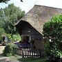 Quaint Farmhouse near River in Oosterwijk