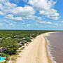 Saadani Safari Lodge - bush, river, beach