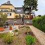 Garden Retreat With Pond View