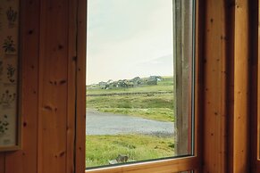 Múlafossur Cottages near Waterfall