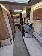 Brand new Touring Caravan Sited all Setup Ready