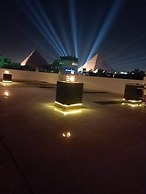 Nefertiti Pyramids View
