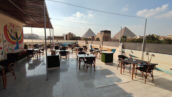 Nefertiti Pyramids View