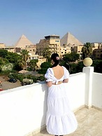 Nefertiti Pyramids View