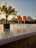 Nefertiti Pyramids View