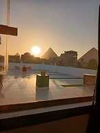 Nefertiti Pyramids View