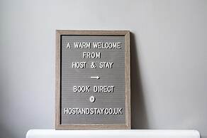 Host Stay Column Mews