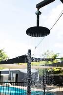 Rosewood Rustic Refuge Pool Outdoor Dining Backyard