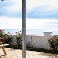 Absolute Beachfront With Decked Garden Oasis and Views