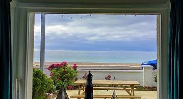 Absolute Beachfront With Decked Garden Oasis and Views