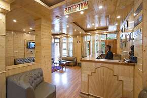 Goroomgo New Harmony Inn Manali