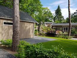 Forest Lodge in Nature With Pond Views