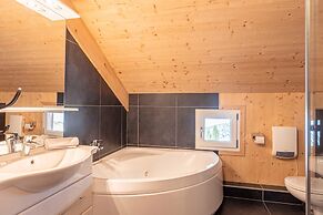 Spacious Chalet With IR Sauna and Whirlpool