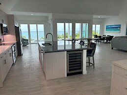 Twin Coves Tranquility: Private Beachfront Estate