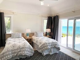 Oceanfront Haven: Elegant Estate With Private Deck