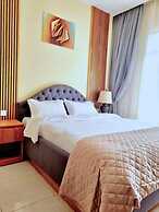 Q-Plus Apartments