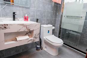 Q-Plus Apartments