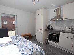 Apartment With a High Chair and bed