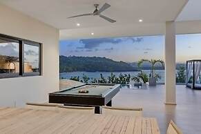 Gorgeous Beach House Perched Right Over the Ocean