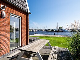Bungalow With an Outdoor Fireplace by Water