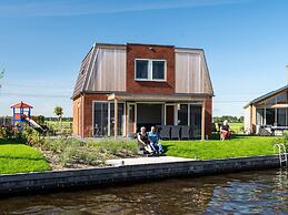 Bungalow With an Outdoor Fireplace by Water
