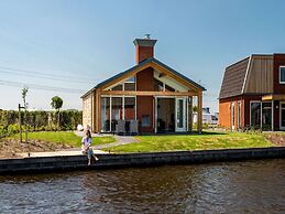 Bungalow With an Outdoor Fireplace by Water