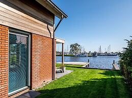 Bungalow With an Outdoor Fireplace by Water