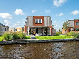 Bungalow With an Outdoor Fireplace by Water