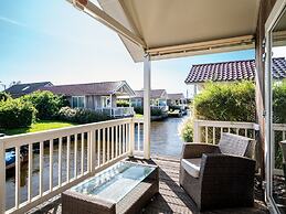 Bungalow With an Outdoor Fireplace by Water