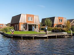 Bungalow With an Outdoor Fireplace by Water