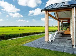 Bungalow With an Outdoor Fireplace by Water