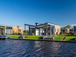 Bungalow With an Outdoor Fireplace by Water