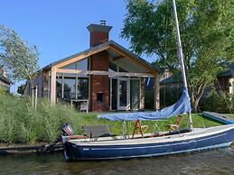 Bungalow With an Outdoor Fireplace by Water