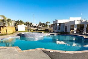 Relaxing Poolside Getaway With Balcony