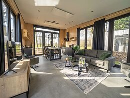 Modern Chalet by the River Maas