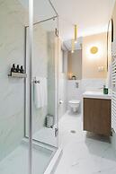 Designer 2-Bedroom Flat with Balcony & Full Amenities Steps from Piata