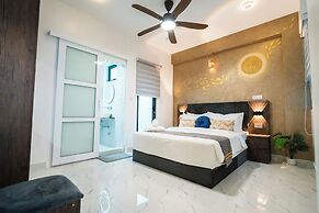 Aina Residency Beachfront Hotel