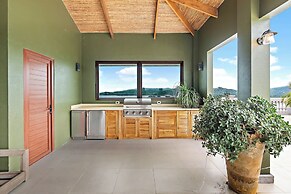 Luxury Condo with Panoramic Ocean Views, Sparkling Infinity Pool, and 