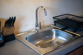 Guest INN Home - Elements Suites