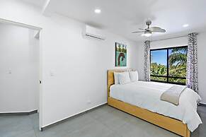 Modern Split-Level 2-Bedroom Condo with Pools, Terrace & Easy Beach Ac