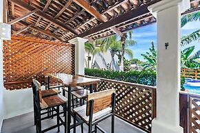 Modern Split-Level 2-Bedroom Condo with Pools, Terrace & Easy Beach Ac