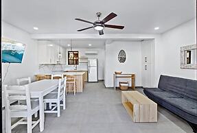 Modern Split-Level 2-Bedroom Condo with Pools, Terrace & Easy Beach Ac
