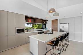 Luxurious Ultramodern Property with Private Suites, Infinity Pool, and