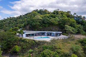 Luxurious Ultramodern Property with Private Suites, Infinity Pool, and