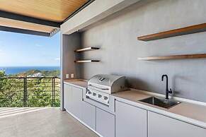 Luxurious Ultramodern Property with Private Suites, Infinity Pool, and