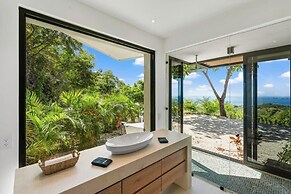 Luxurious Ultramodern Property with Private Suites, Infinity Pool, and